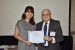 Dr. Nagib Callaos, General Chair, giving Ms. Peishi Goh the best paper award certificate of the session "Education and Training: Concepts, Technologies and Methodologies I." The title of the awarded paper is "Flipped Science Inquiry@Crescent Girls' School."